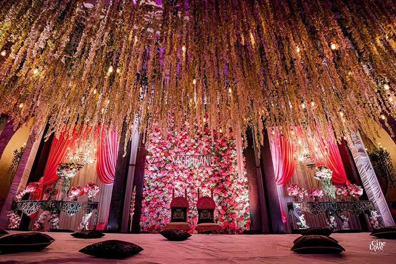 Wide view of the decorated venue stage with orange lighting