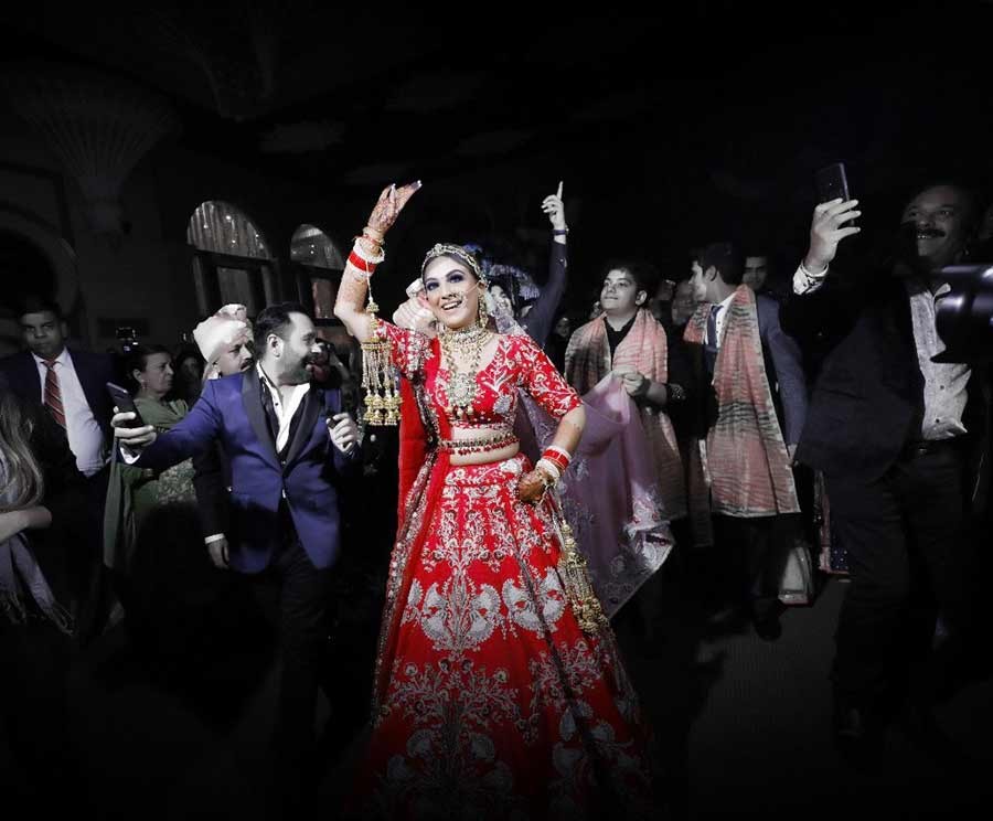 Guests celebrating in an evening setting at Saurabh and Gargi's wedding