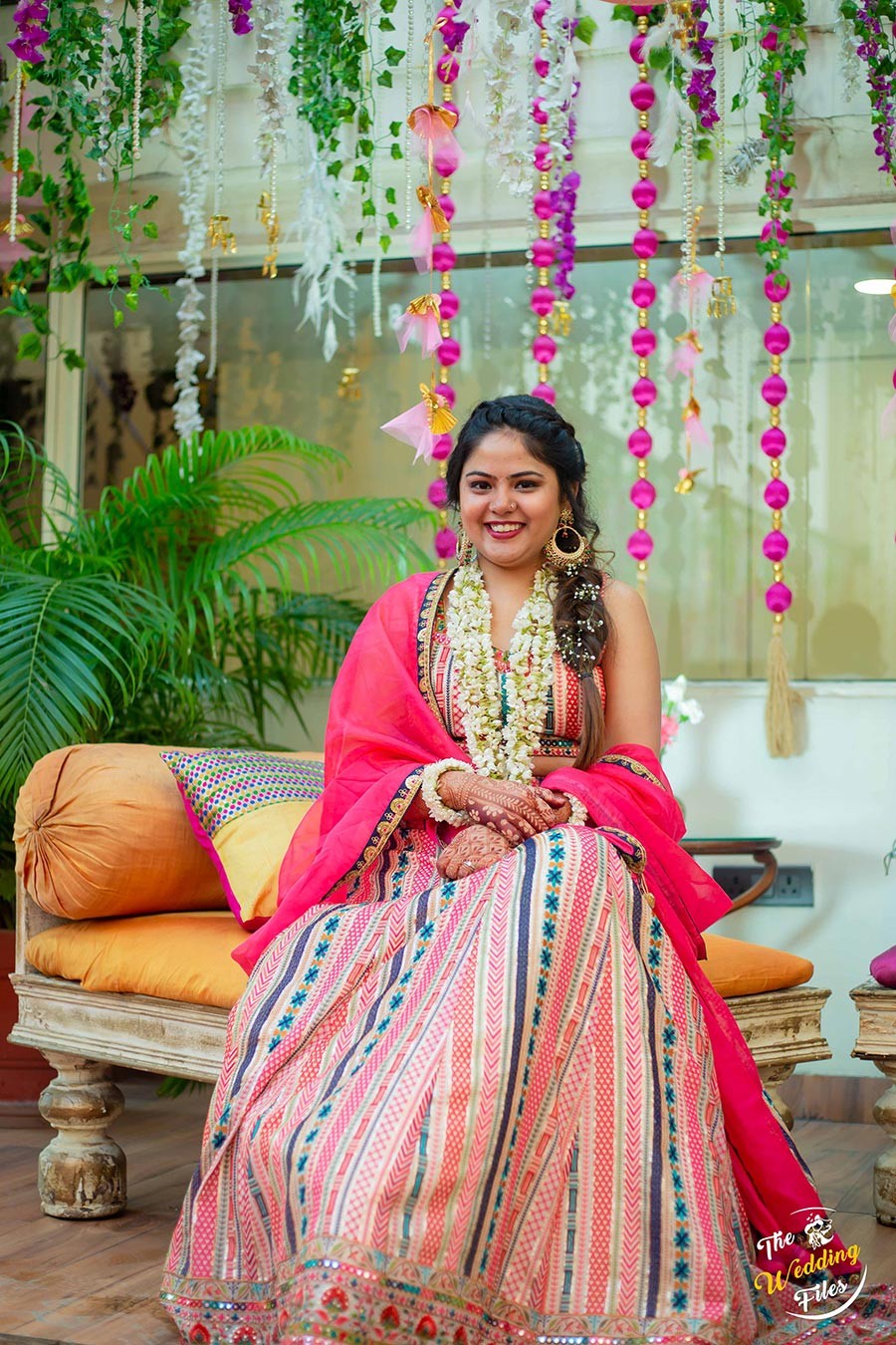 Bride Sanya posing in her bridal attire during her wedding to Anish
