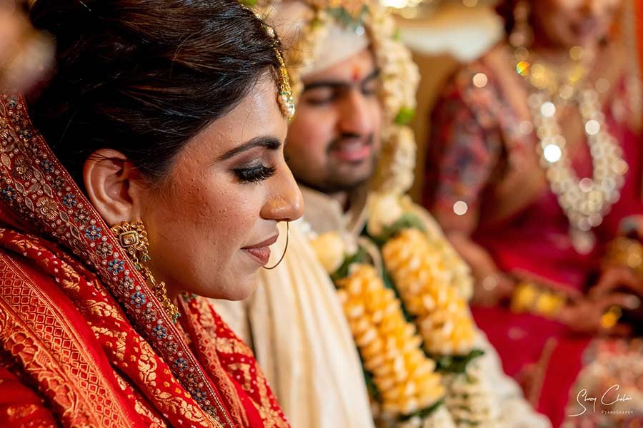 Bride and groom exchanging garlands during the ceremony