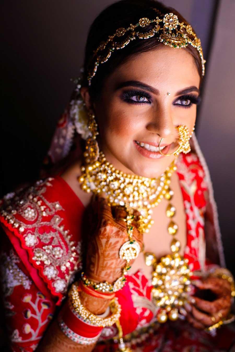 Close-up of bride Gargi smiling during her wedding to Saurabh