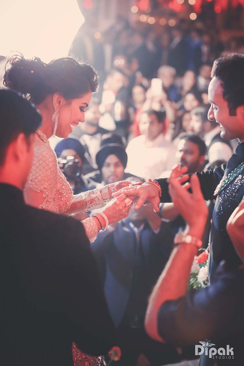 Shreejeet and Tanvi amid a joyful confetti celebration at their wedding
