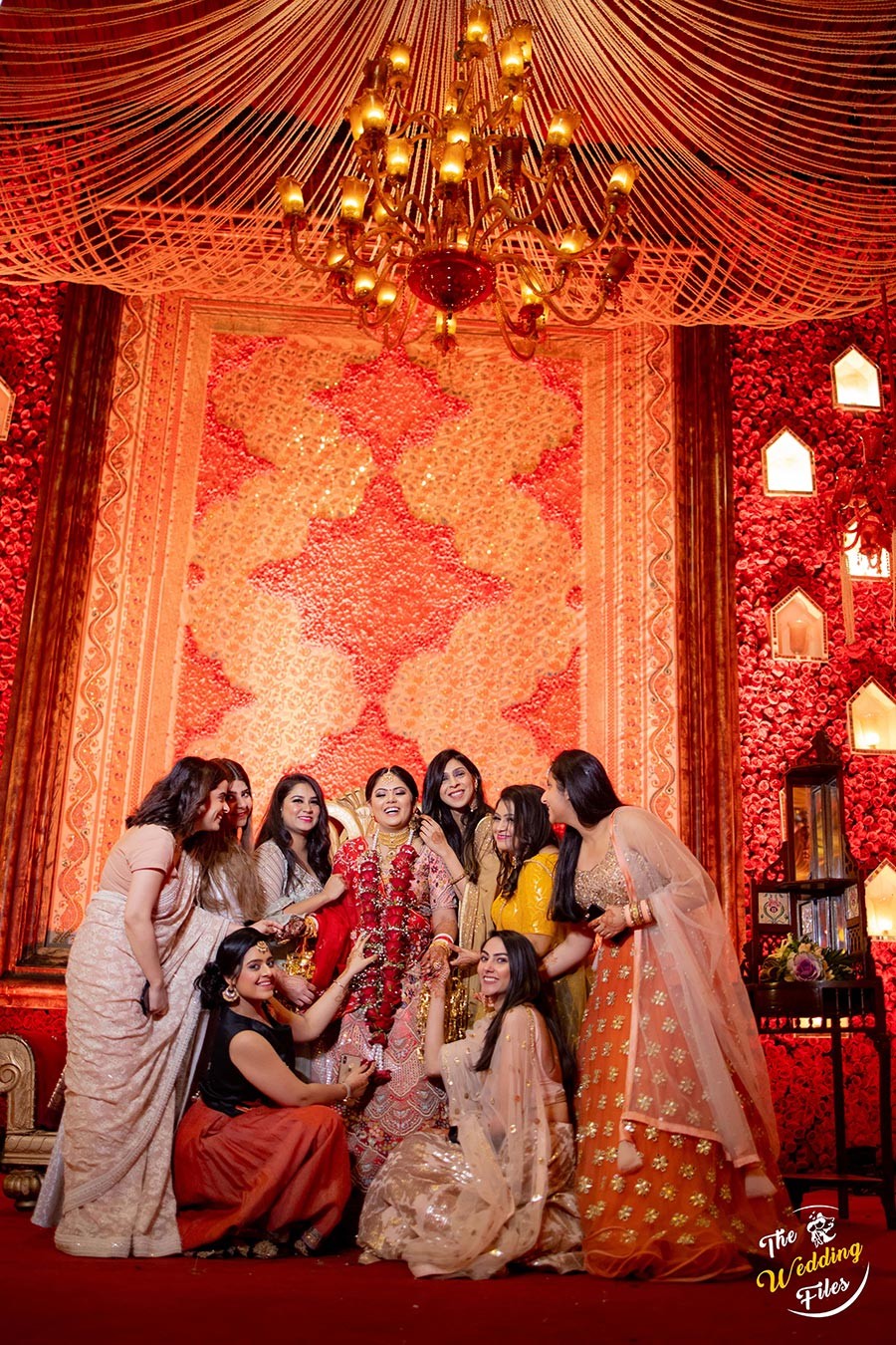 Warmly lit ceremonial decor with hanging florals at Sanya and Anish's wedding