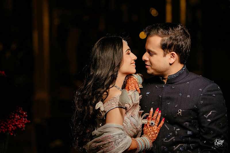 Close-up of bride and groom embracing