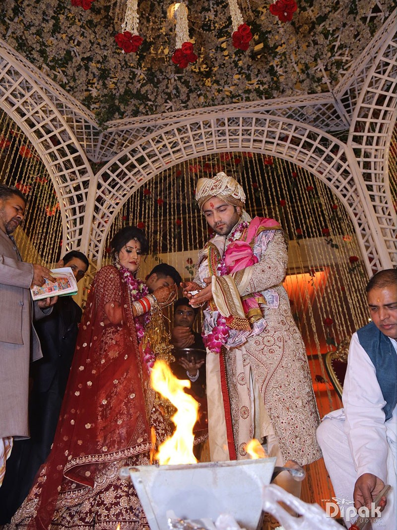 Bride Garima at her wedding ceremony amid decor