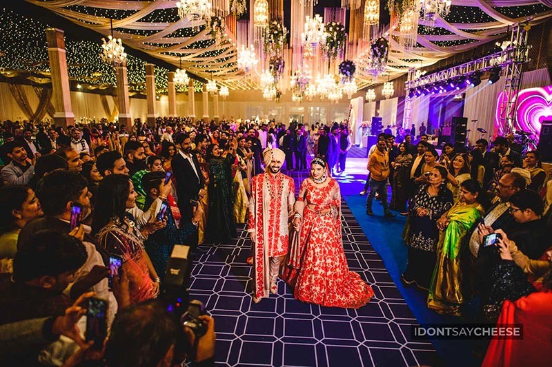 Guests celebrating together under colourful party lights