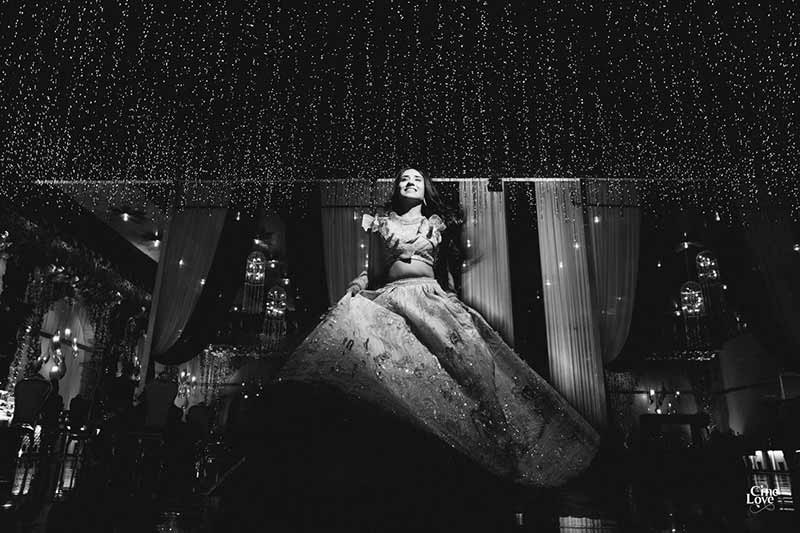 Black and white photo of bride posing solo