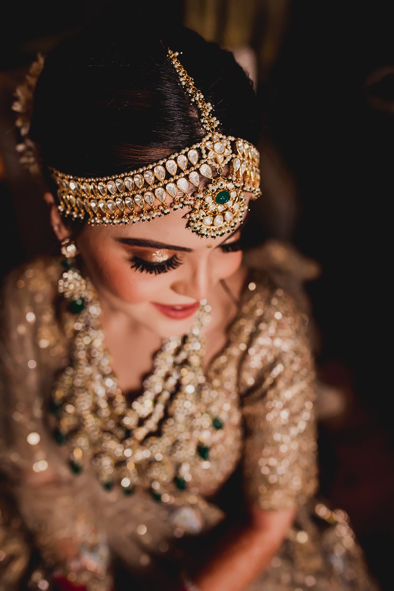 Portrait of bride Neha adorned with bridal jewellery