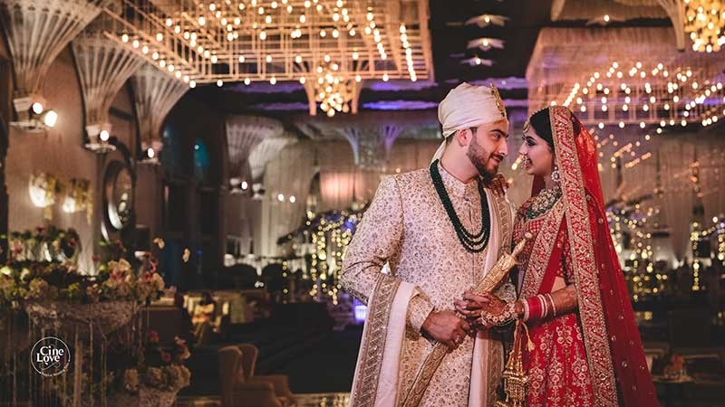 Priyansh and Priyanka in traditional Indian wedding attire