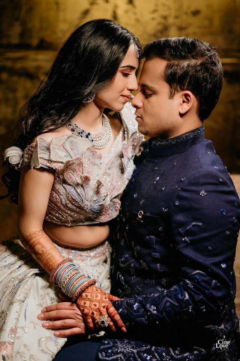 Close-up of bride and groom together in formal dark attire