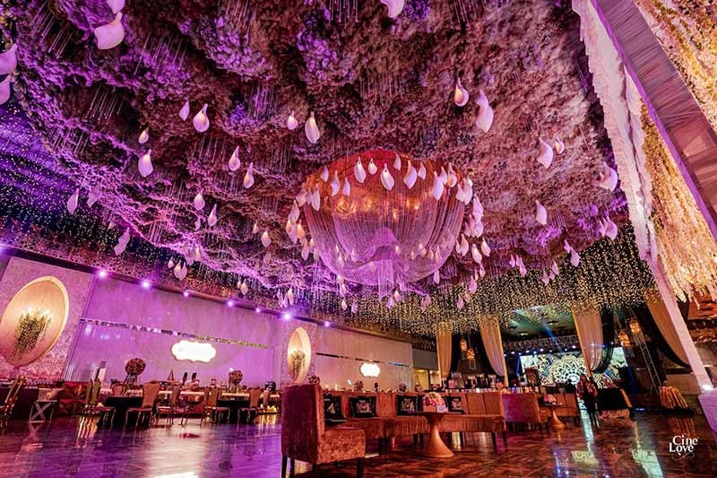 Wide view of the decorated venue with purple lighting