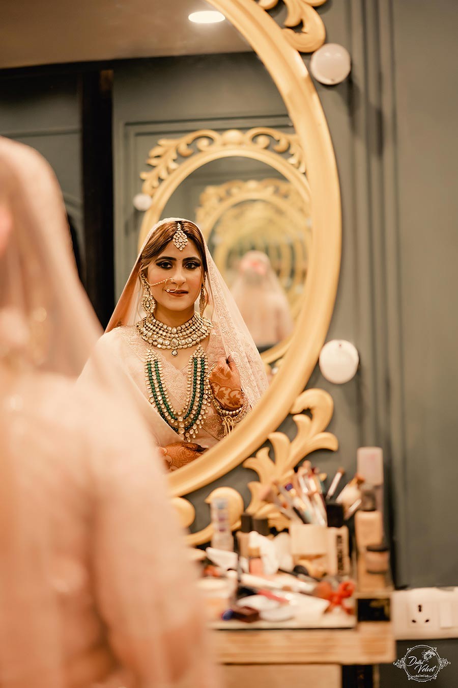 Close-up of the bride's henna-adorned hands and bridal jewelry at Prakriti and Sahil's wedding