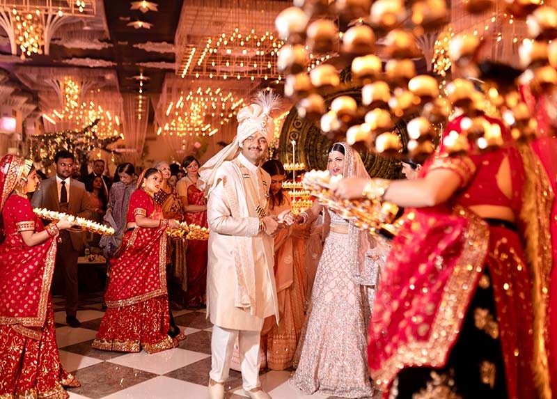 Wide view of the couple at the decorated wedding venue