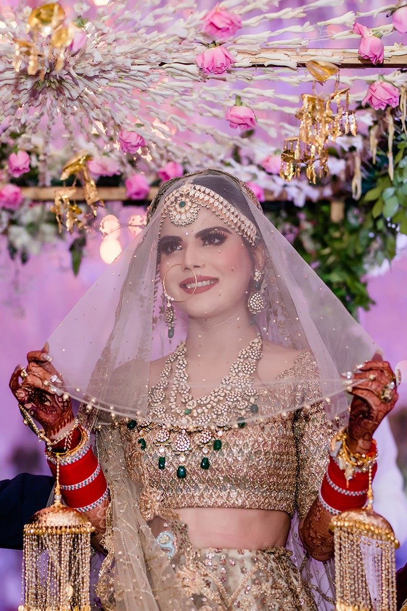 Portrait of bride Neha with veil and jewellery