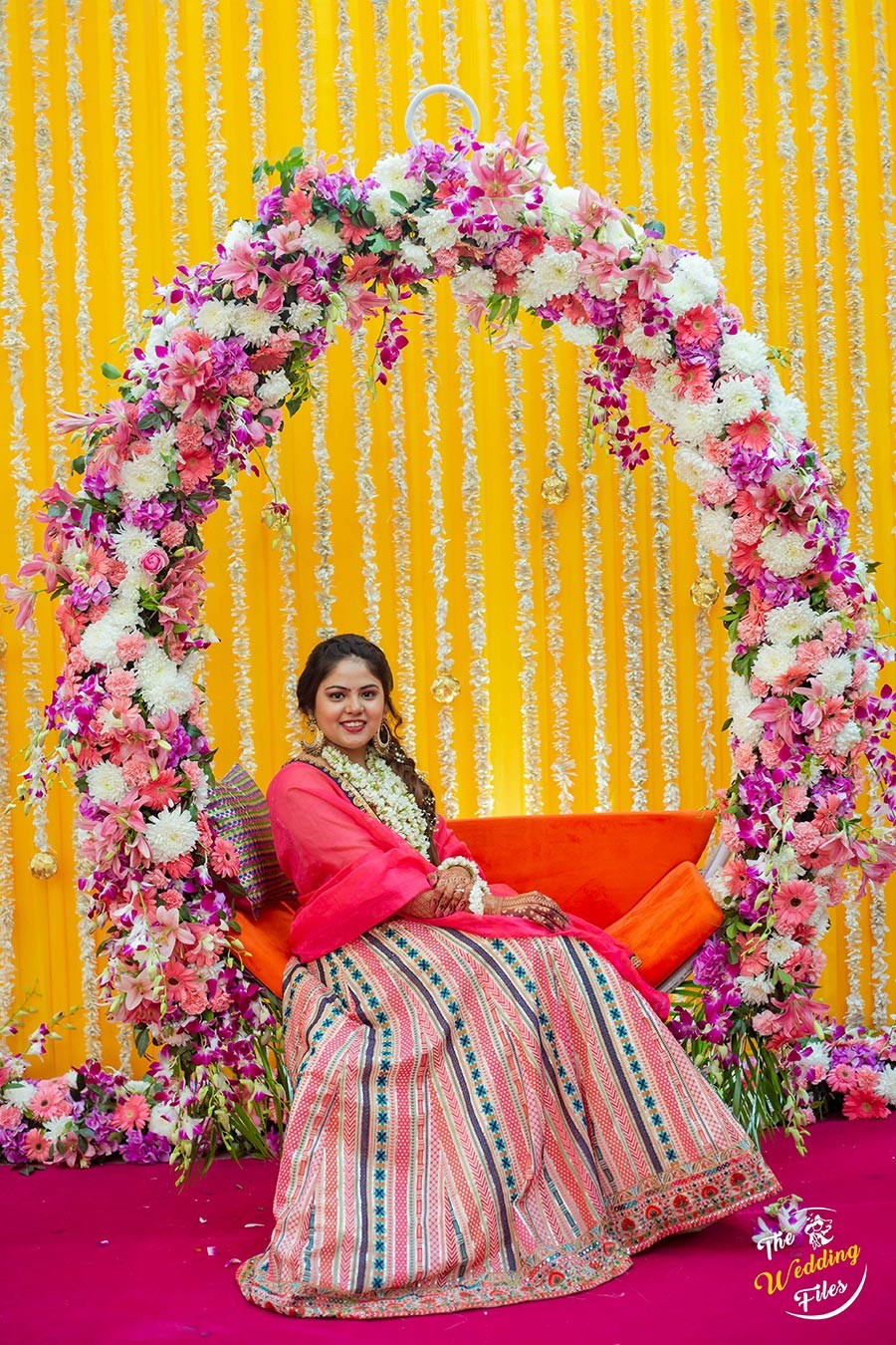 Bride Sanya in a golden-hued setting during her wedding celebration