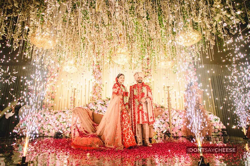 Close-up of bride and groom together with confetti falling