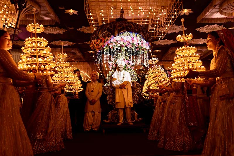 Wide view of the couple at the decorated wedding venue