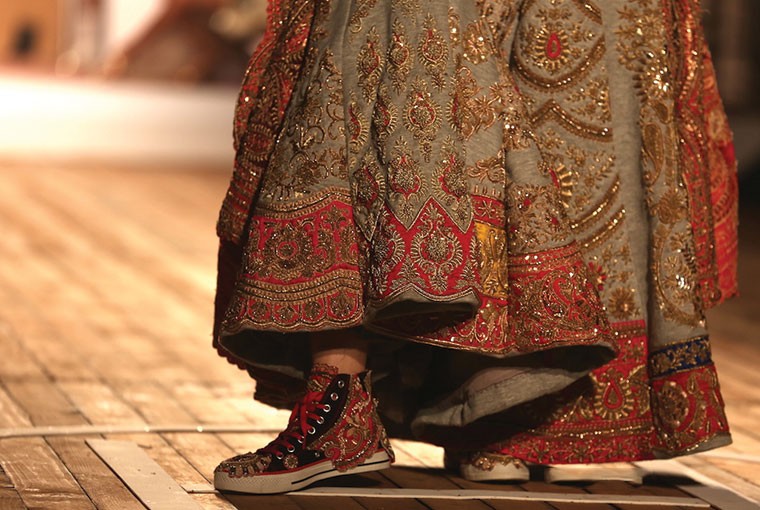 Embellished sneakers by Monisha Jaising