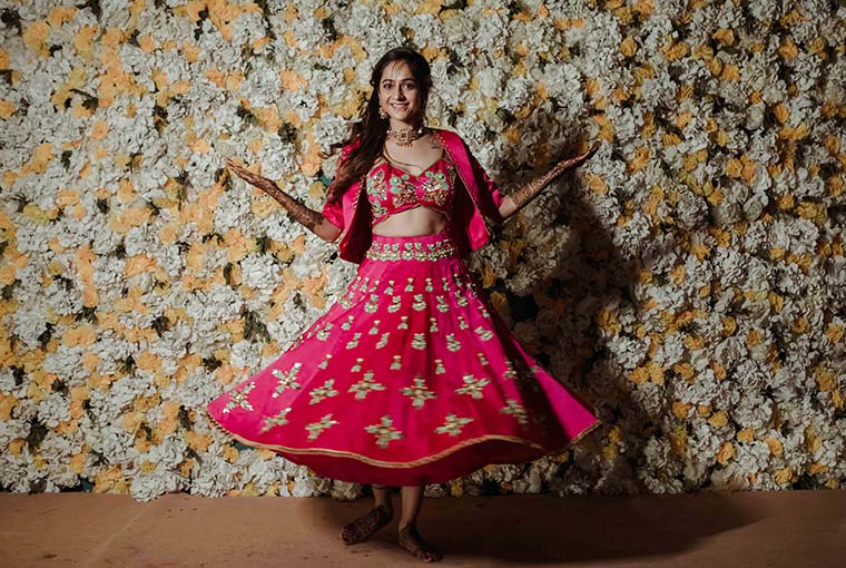 An All Bright Mehendi Ceremony With A Bride In Bright Pink Outfit