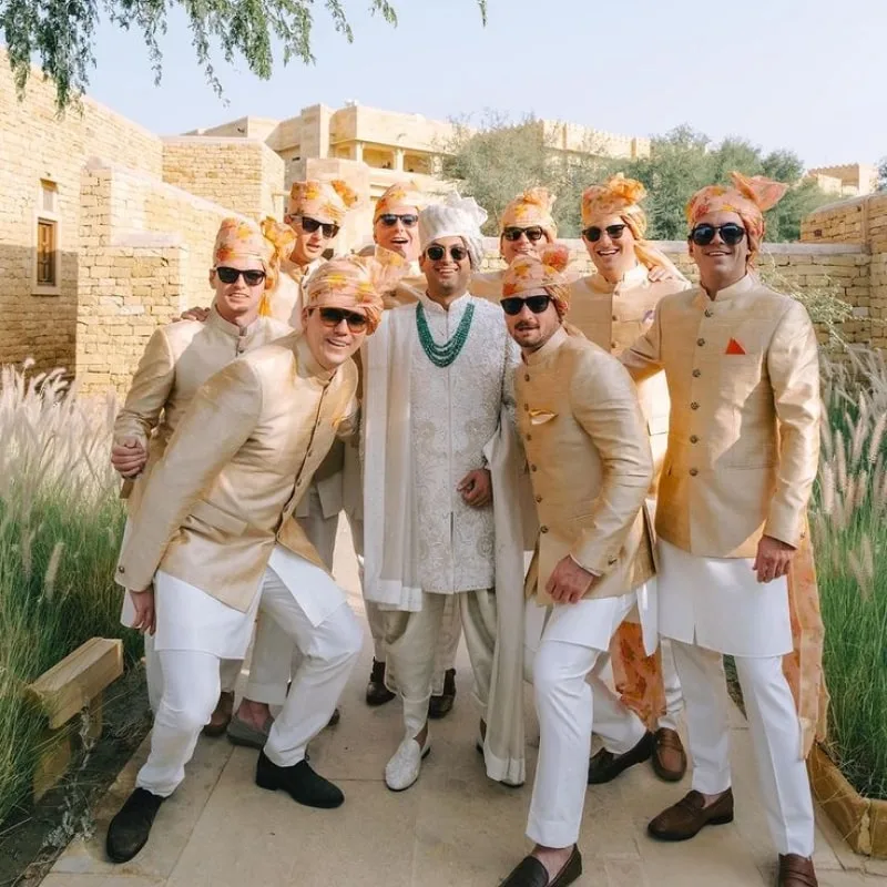 with friends groom poses